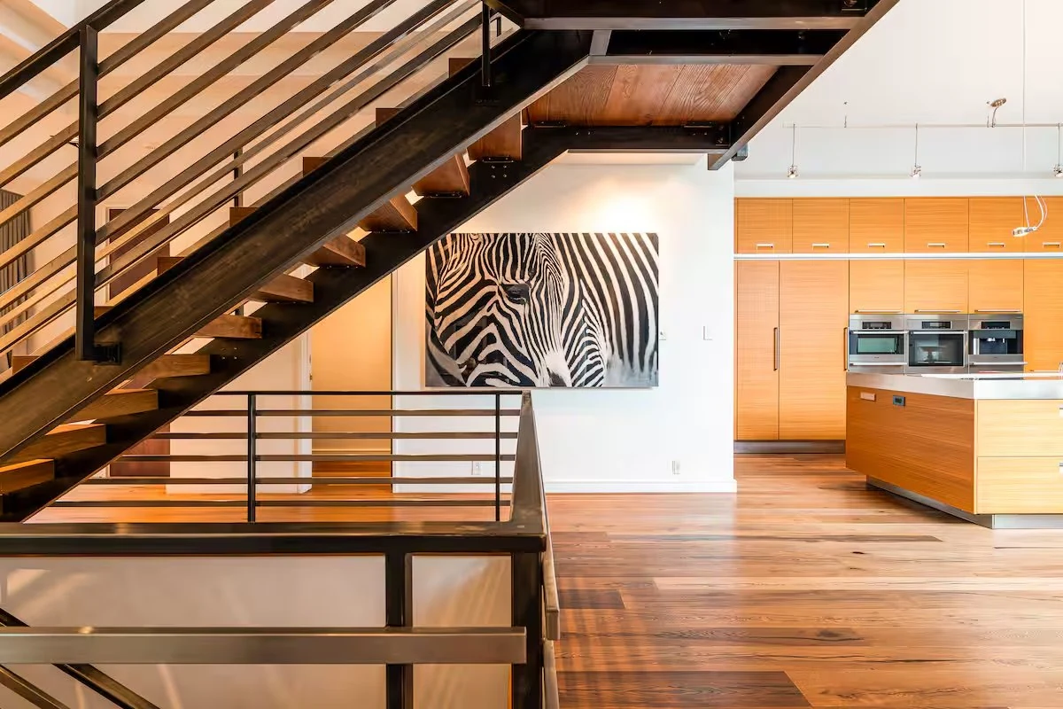 Steel staircase and kitchen interior